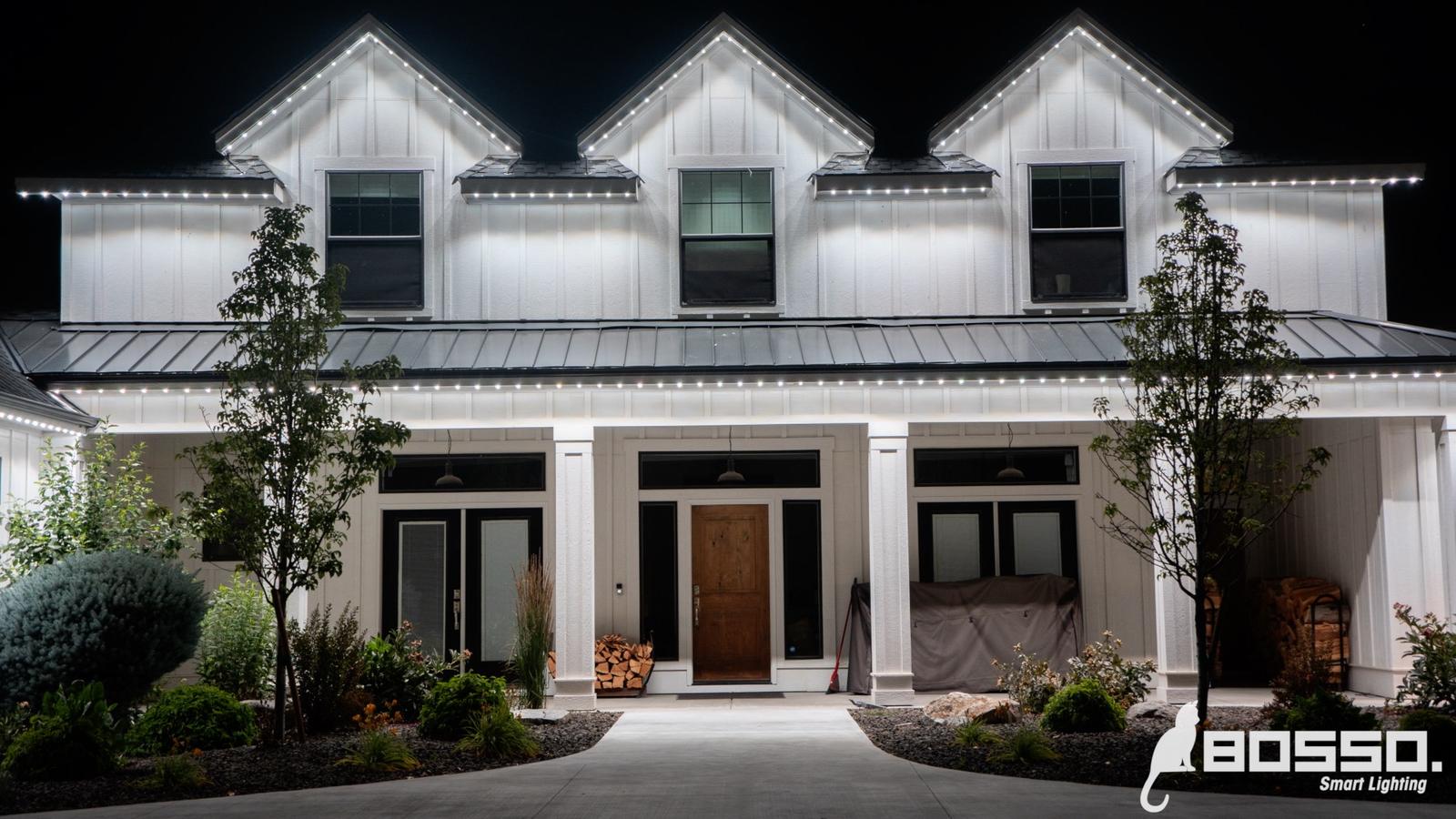 Suburban home shown in daylight (lights invisible) and twilight (lights spectacular)